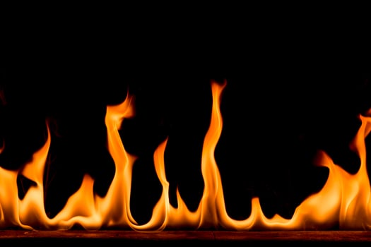 Nature Fire flames on black background. Freeze motion of Red-Yellow fire flames burning at dark night. photo