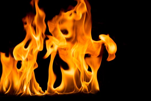 Nature Fire flames on black background. Freeze motion of Red-Yellow fire flames burning at dark night. photo