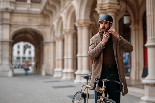 Hipster putting on a helmet. Safety bicycle transport photo