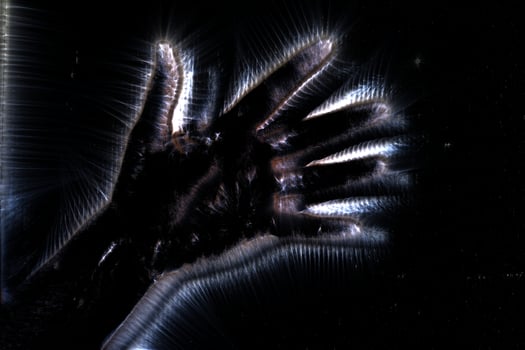 3D-Illustration of a glowing human female hand with a kirlian aura showing different symbols photo