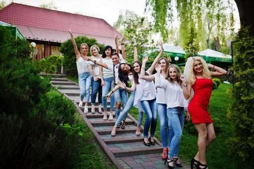 Girls having fun while posing outside in the park on the bachelorette party. photo