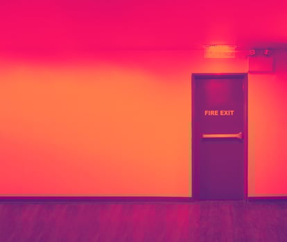 Fire exit door. Fire exit emergency door red color metal material photo