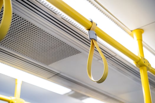 Close up the rubber - plastic cable hand holding in ariport rail link train. photo