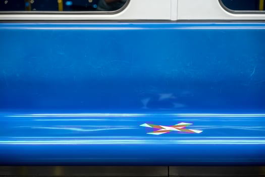 blue seat row in the train with crossed marking tape in Coronavirus COVID-19 period. It means Social Distancing in transportation. photo