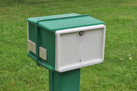 Electric power sockets column in a camping area for caravans photo