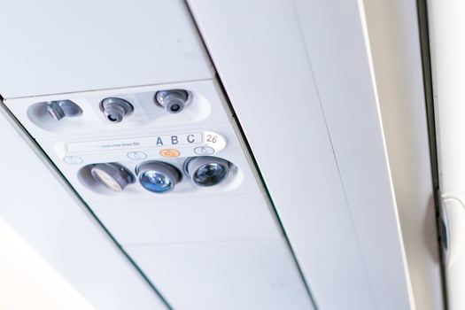 closeup airplane Console panel lamp, light, need help button, air condition, sefty belt and no smoking lighting sign. photo