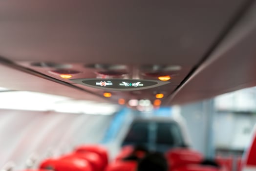 closeup airplane Console panel lamp, light, need help button, air condition, sefty belt and no smoking lighting sign. photo