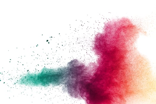 Abstract multi color powder explosion on white background.  Freeze motion of  dust  particles splashing. Painted Holi in festival. photo