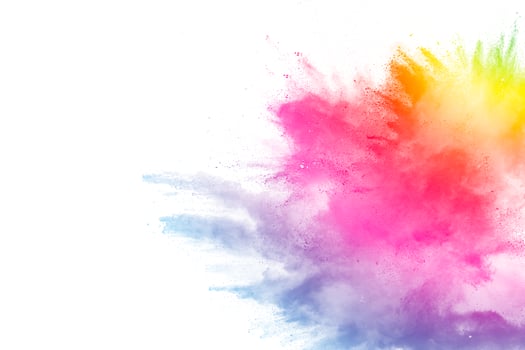 Freeze motion of colored powder explosions isolated on white background photo
