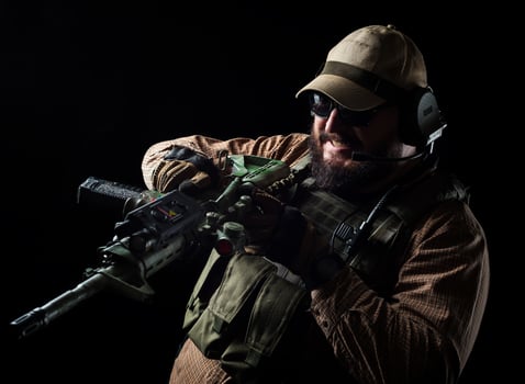 Armed soldier ready for battle. Military concept. photo