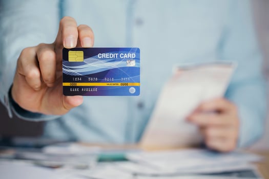 Businessman payment bill receipt with credit card , business e-commerce to pay credit card debt concept photo