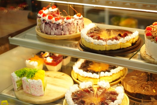 cake in glass cabinet cut into pieces Sold in a coffee shop photo