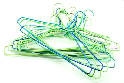 multi colored hangers on a white background photo