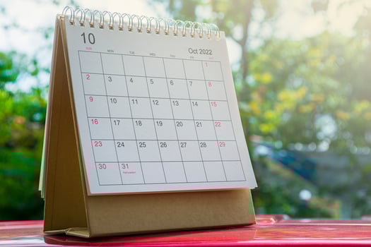 White October 2022 calendar on green background. New Year Concept photo