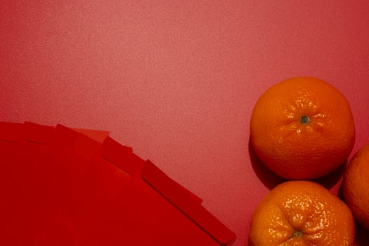 Chinese New Year Concept - Mandarin oranges and red packet photo