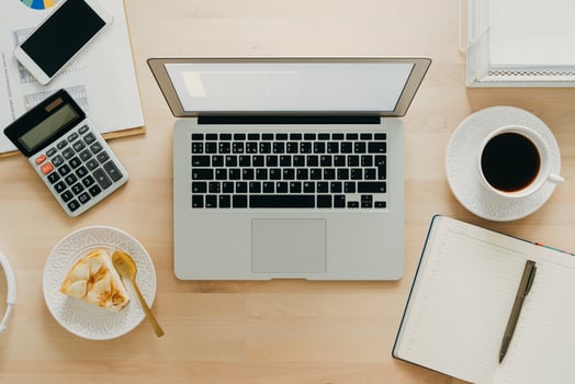 Work from home, online learning. Wooden desk, table. Top view. Distance education. Food with job. photo