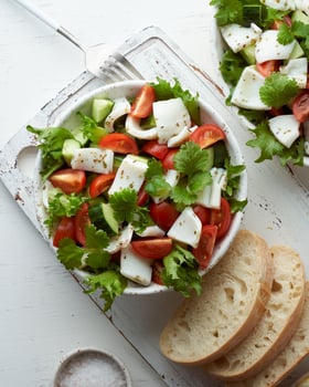 Salad with squid, cucumbers, tomatoes and lettuce. LCHF, FODMAP, paleo diet. photo
