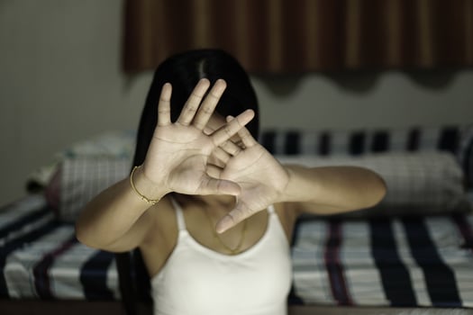 Woman raised her hand for dissuade, campaign stop violence against women photo