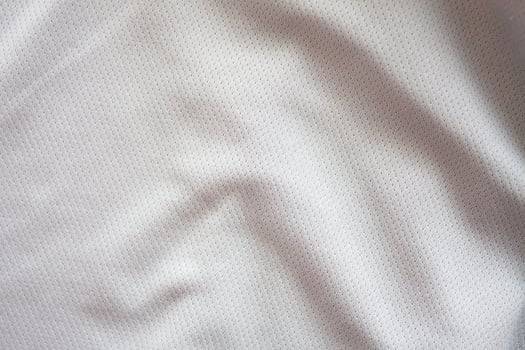 Close up shot of white textured football jersey photo