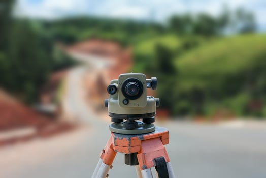 road construction site, theodolite instrument for road construction photo