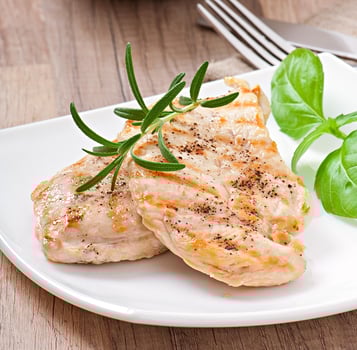 Grilled chicken breasts and vegetables photo