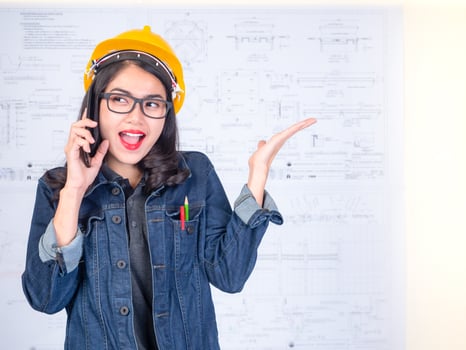 Female engineers are calling to talk about construction work photo