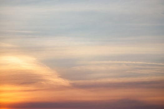 Sunset in sky. Orange and pink striped clouds at twilight. Natural background. photo