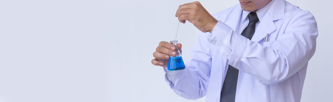 young man scientist in chemistry lab photo