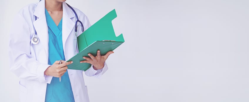 Doctor holding a clipboard with prescription photo