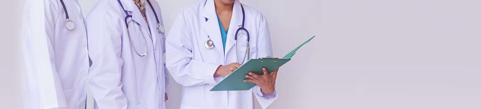 Doctors holding a clipboard with prescription, concept teamwork photo