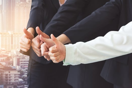 Successful business people with thumbs up, business team photo