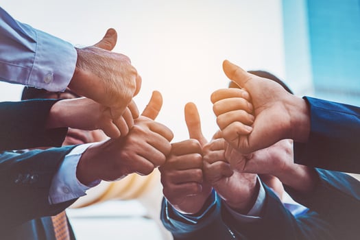 Successful business people with thumbs up and smiling, business team photo