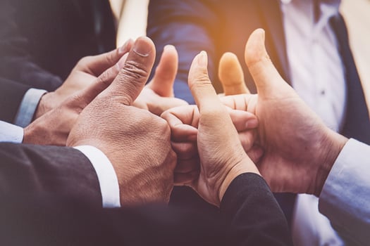 Successful business people with thumbs up and smiling, business team photo