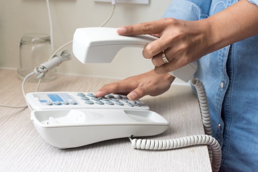 Hand of woman using telephone photo