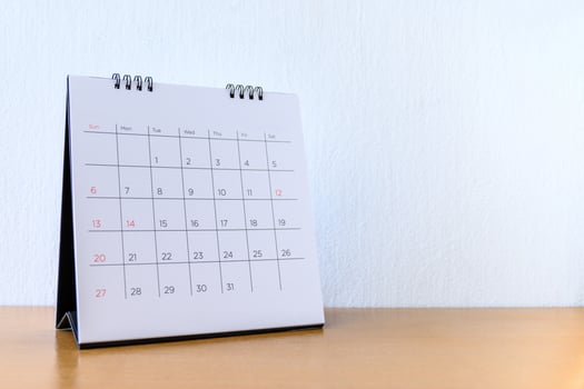 Generic Calendar With Days on wood table photo