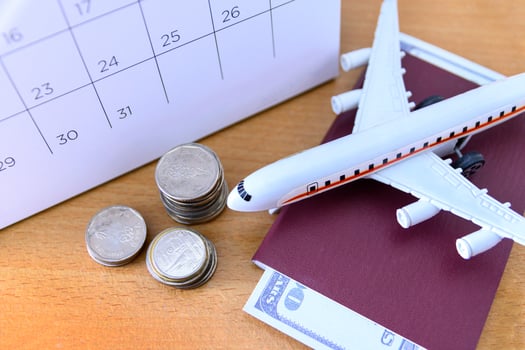 Airplane model with paper calendar on wooden table. plan for trip photo