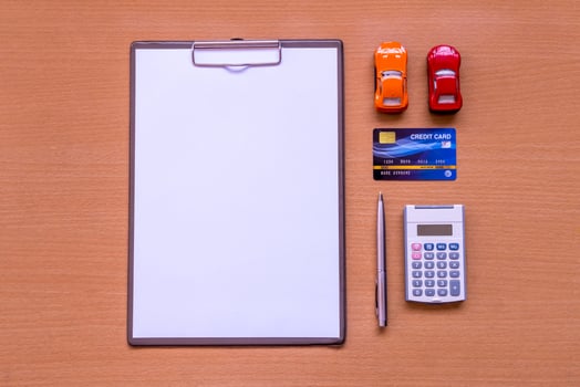 White paper Car form with model and policy document photo