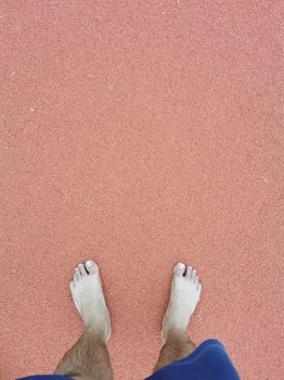 The barefoot running on tracks. photo