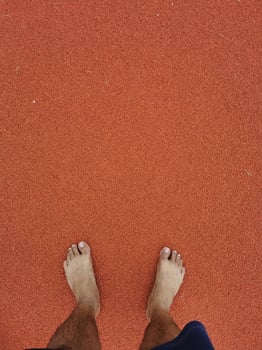 The barefoot running on tracks. photo