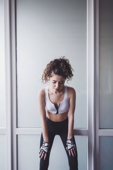 athletic brunette woman resting photo