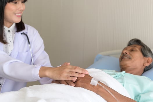 Doctor holding senior patient's hand in hospital, health care and medical concept photo