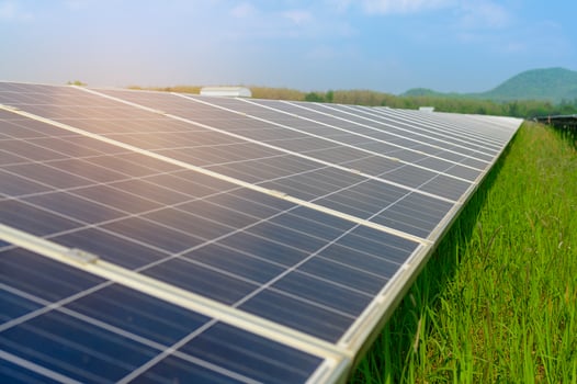 Background of Photovoltaic Cell Farm or Solar Panels Field, eco friendly and clean energy. photo