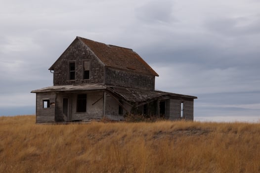Abandoned House on a golden field photo