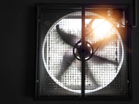 Big industrial Exhaust fan in a factory. Ventilation of plant building. With Shiny light. photo