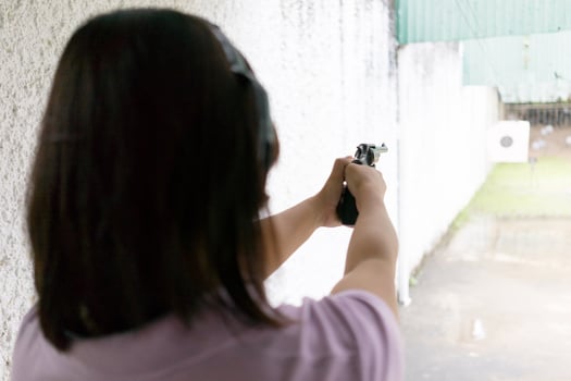 women shooting target photo