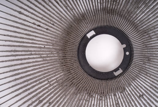 dirty electric fan on white background photo