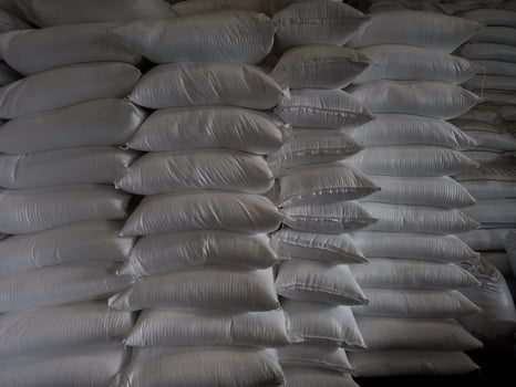 Chemical fertilizer The product stock is packed in sacks, stacked in the warehouse, waiting for delivery. photo