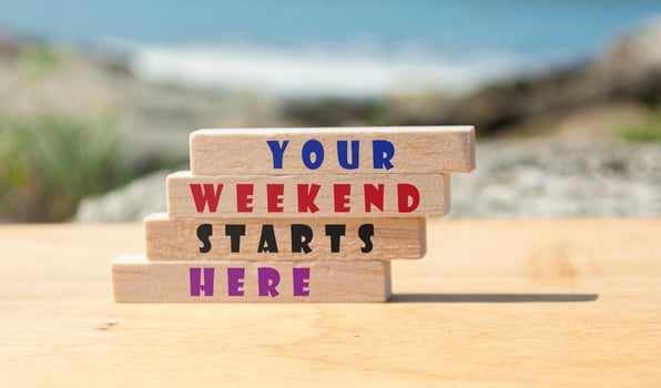 Motivational quote on wooden block with blurred background of ocean photo