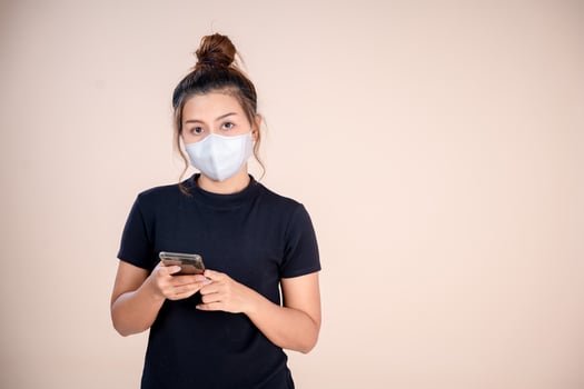 Woman wearing anti-virus mask to prevent others from contracting Corona COVID-19 and SARS cov 2. photo