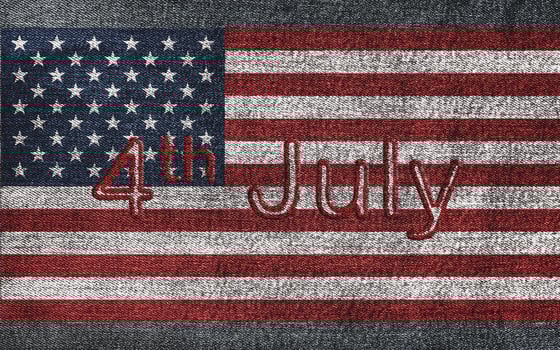 4th of July text on American flag on denim jeans photo